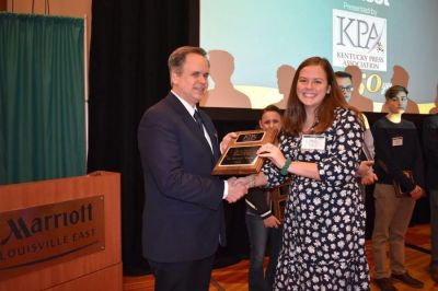 Bailey Vandiver accepts the Kentucky Press Association’s Most Valuable Member of the Year award, which outgoing president Peter Baniak awarded to the state s student journalists at the Kentucky Press Association convention on Jan. 25, 2019. 
(Teresa Revlett, Kentucky Press Association)