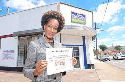 Northside Vibes by Flavor News CEO Deone McWilliams proudly holds one of her first issues after she started publishing.