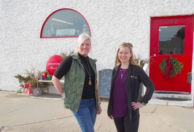 Amy Johnson and co-worker Kelsi McGee in front of the Springview Herald office in Springview, Nebraska.