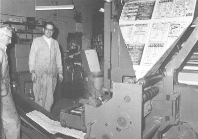 Bill Blauvelt (center) shows off the Superior Express press room soon after the press was installed.  Lyle McCammon (far left) promoted the idea that the newspaper needed its own press.
